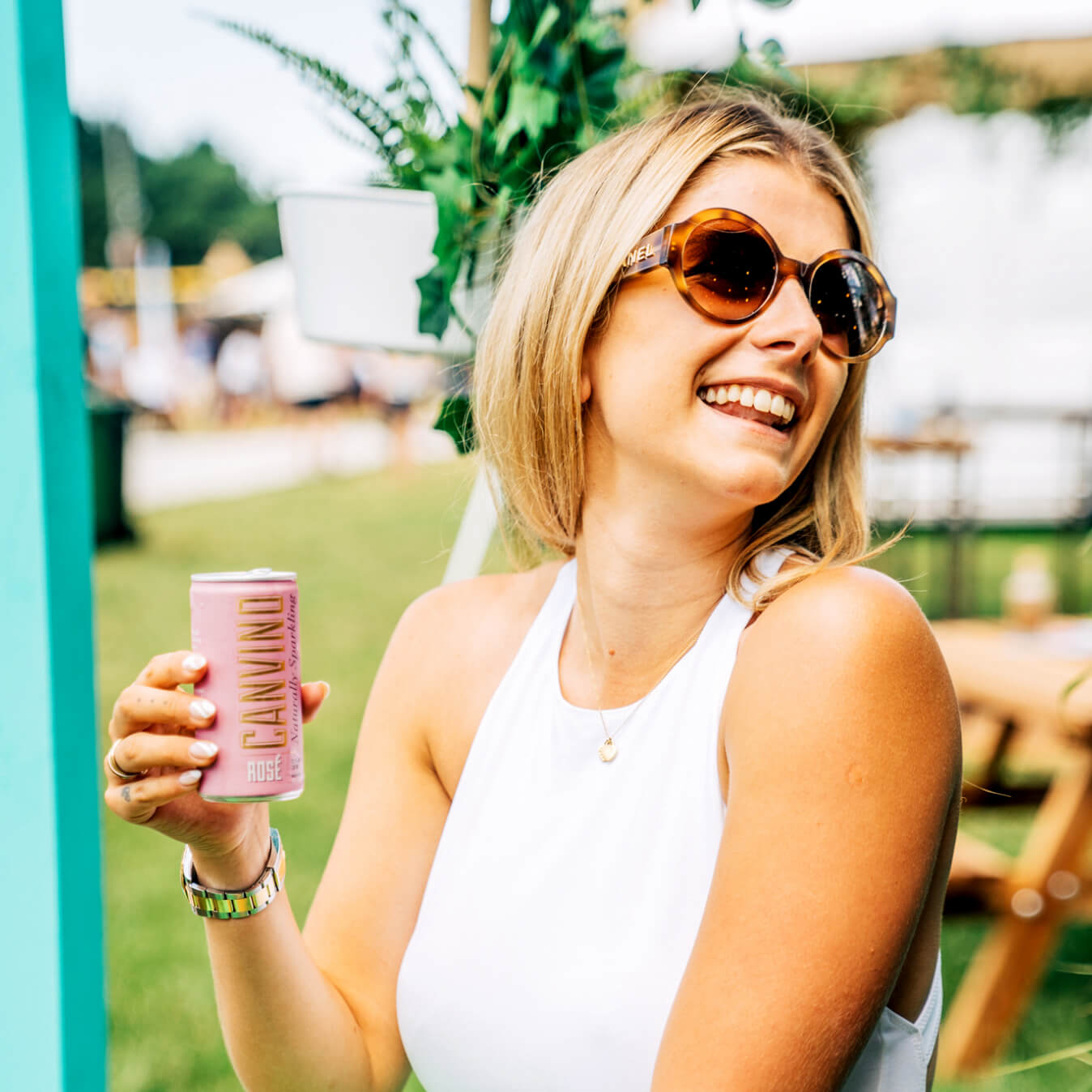 Woman smiling and drinking Canvino at Taste of London