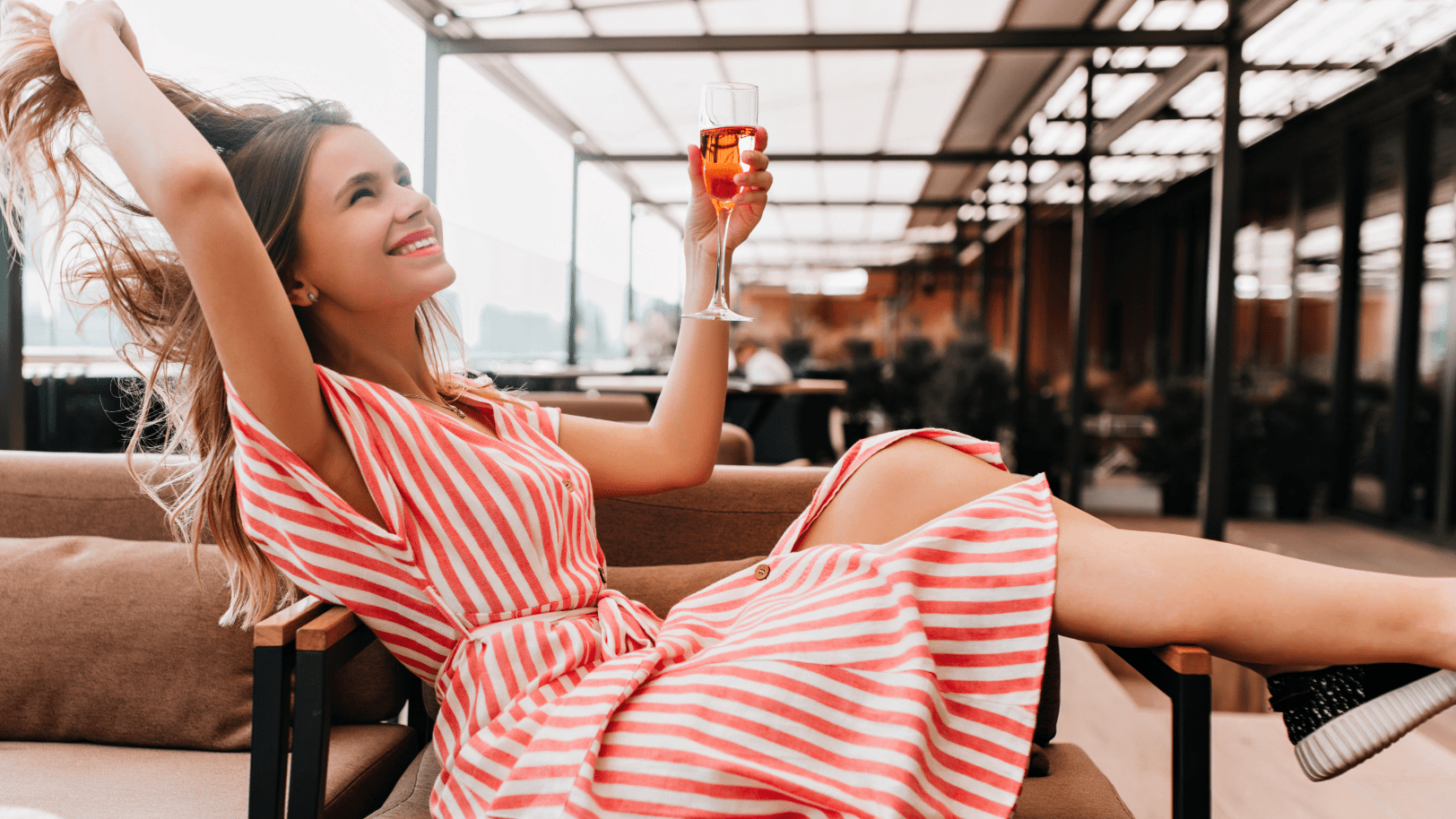 Woman with wine glass posing for photo